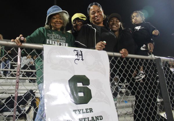 Donetta Chester and family show up five generations deep to support Tyler Cleveland during senior night at Hawkins High School Football, cheer and dance squad.