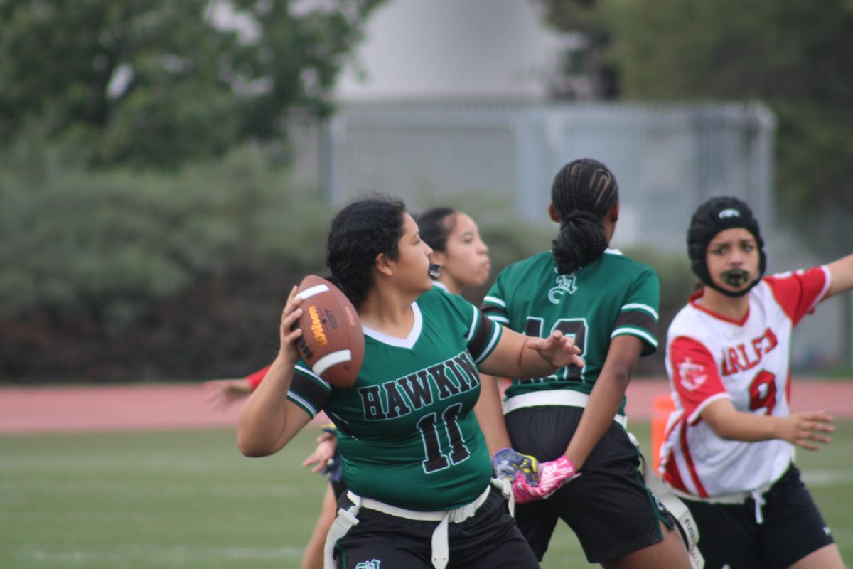 Quarterback Desire Bravo (The Goat) ready for a hail Mary pass against Arleta HS where the Lady Hawks won 26-20.