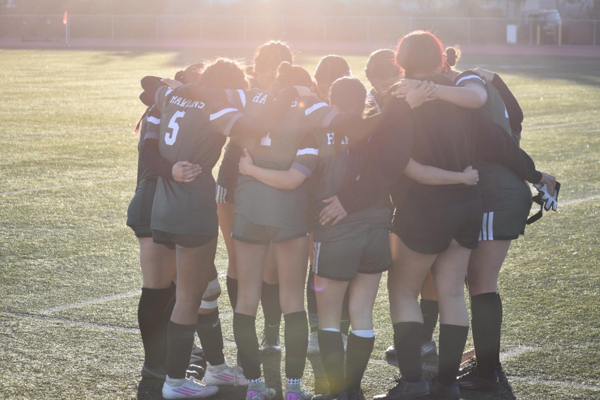 Lady Hawks saying their team prayer before game