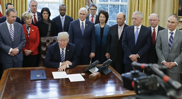 Trump and his Cabinet members all standing around each other; Pablo Martinez Monsivais/Politico