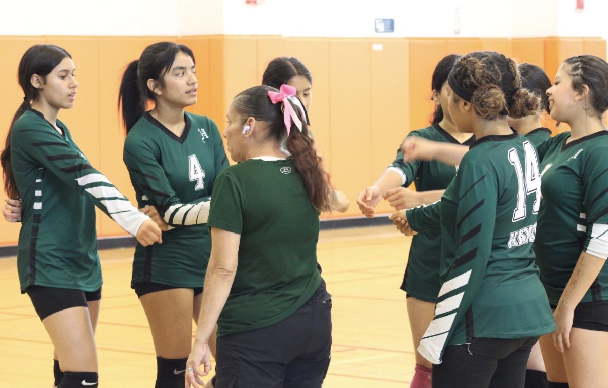 Coach Francis Doing a Pre break for the girls before the game starts in order to motivate the girls to fight and play hard.